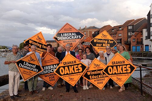 Lib Dem Members & Supporters all standing behind Graham, the new Lib Dem Candidate for Bridgwater holding up Lib Dem signs.