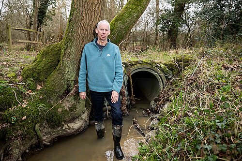 John Milne visiting a local stream