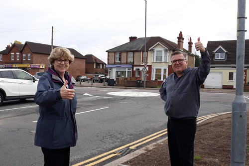 Councillors Christine McHugh and Tim Caswell at the roundabout at the junction of Goldington Green and Goldington Road