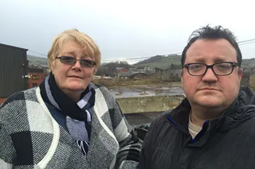Irene and Andy at the site of Coral Mill in Newhey