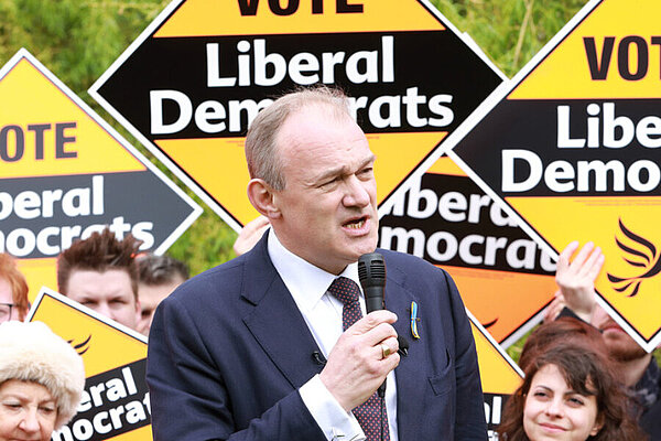Ed Davey Ed Davey in front of a crowd holding Liberal Democrat posters