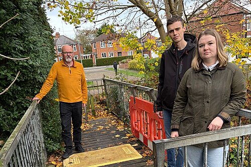 Campaigners Danielle Mason, Andrew Mortimer and Caleb Pell at the Moore Avenue footbridge