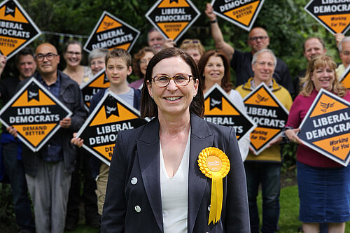Emma Matanle surrounded by supporters