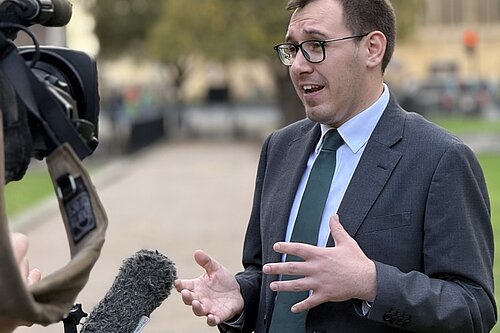 Tom talking to a camera