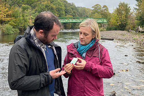 Lisa Smart MP and Councillor Mark Roberts test water quality at the River Goyt
